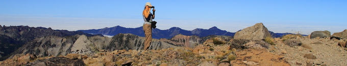 woman photographer surrounded by mountains woman photographer surrounded by mountains