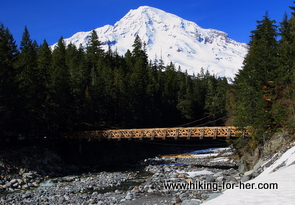 Mt. Rainier in background of wooden bridge