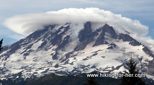 White lenticular cloud surrounding summit of Mount Rainier