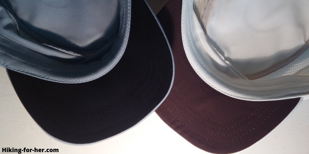 Anti-glare dark colored underside of two hiking hats Anti-glare dark colored underside of two hiking hats