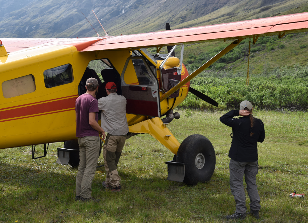 Unloading a bush plane at Skolai in Wrangell St Elias National Park and Preserve Alaska USA