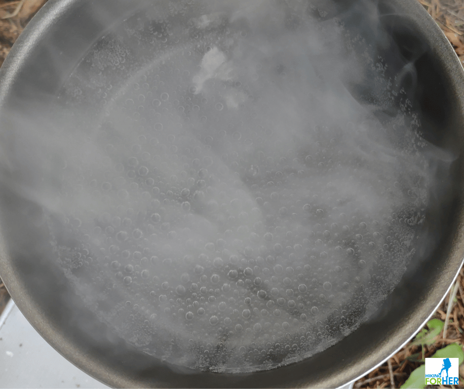 Ganesha ultralight backpacking stove used to achieve a rolling boil and steam in a cooking pot