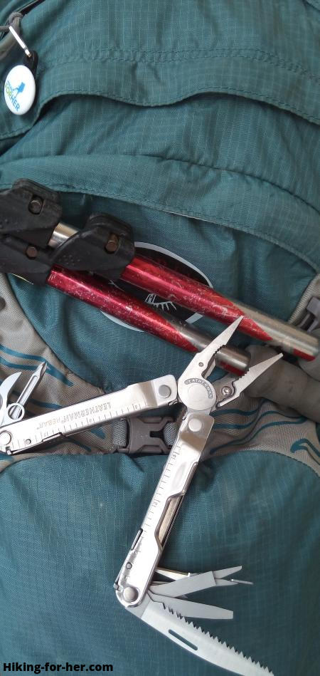 Leatherman multitool resting on hiking backpack Leatherman multitool resting on hiking backpack