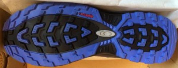 Hiking shoe tipped on its side to display the tread