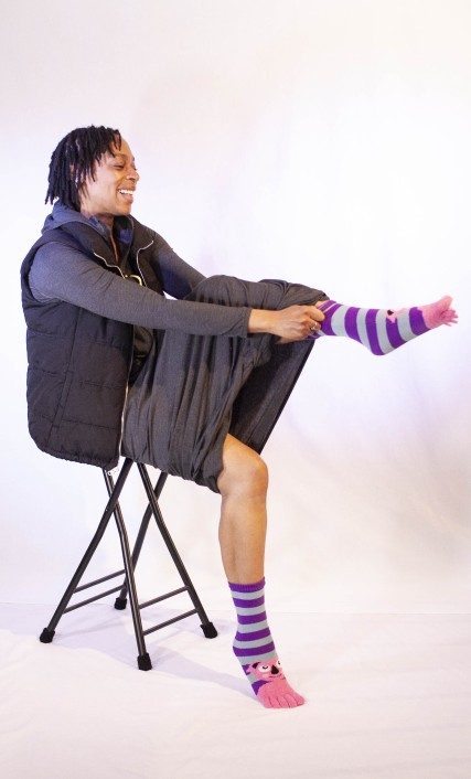 Female hiker wearing layers in a backpacking sleep system, including a Unightie Female hiker wearing layers in a backpacking sleep system, including a Unightie